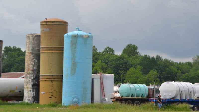 Two people trapped inside a tank, one man died