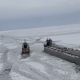 After being released from the ice on frozen Lake Erie, a freighter is seen moving